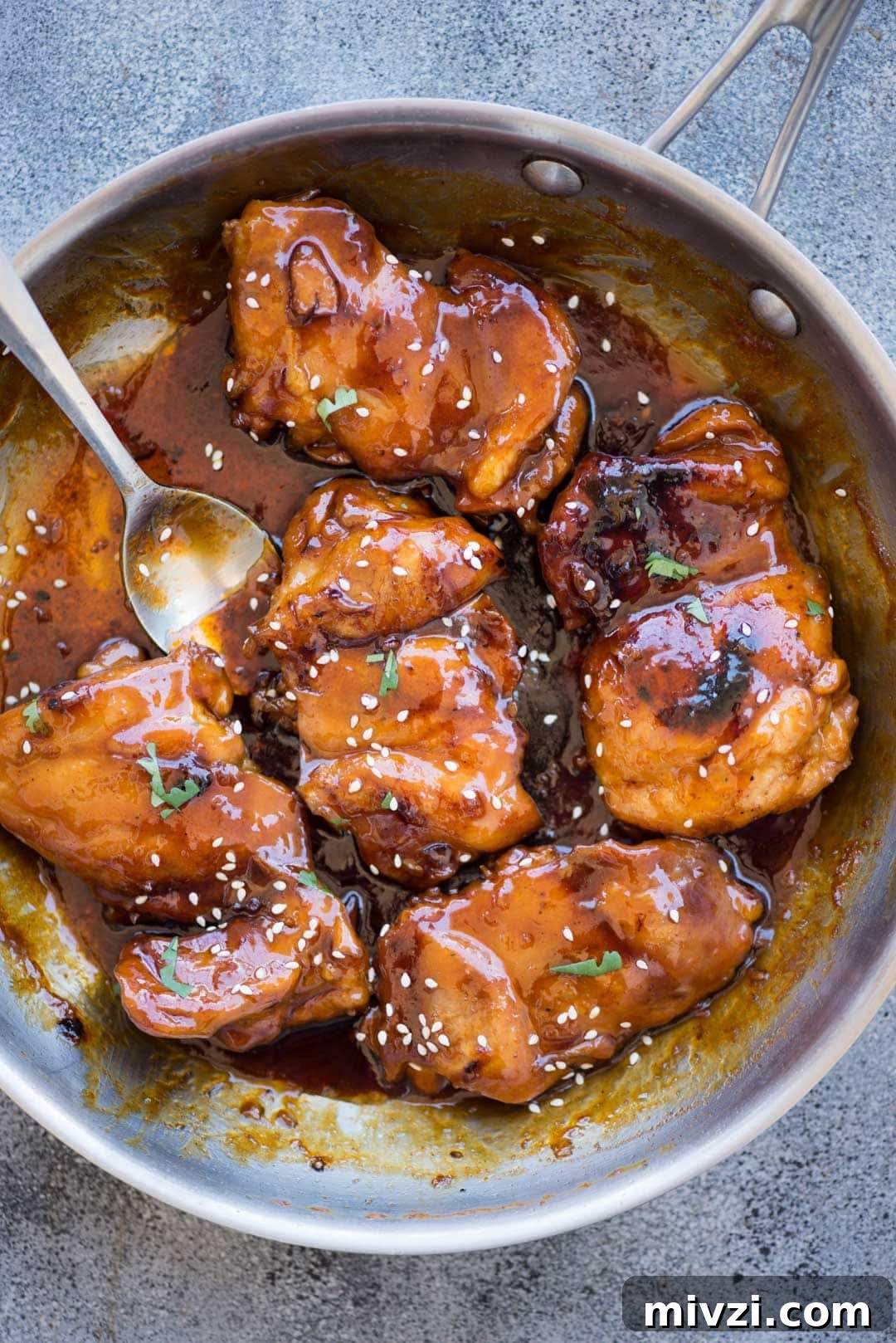 Honey Sriracha Chicken has Juicy chicken thighs in an incredibly delicious sticky, sweet and spicy Honey Sriracha sauce. You need less than 20 minutes to make this recipe with basic pantry ingredients.  
