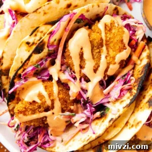 Crispy Panko Shrimp Tacos with Tangy Slaw 11 Panko shrimp tacos stuffed with crispy fried shrimp, cilantro lime slaw, and spicy mayo wrapped in fire grilled tortillas