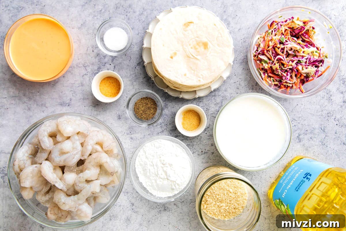 Crispy Panko Shrimp Tacos with Tangy Slaw 4 Crispy shrimp taco recipe ingredients include shrimp, spicy mayo, oil, slaw, Panko breadcrumbs, cornstarch, seasonings, and oil for deep frying.