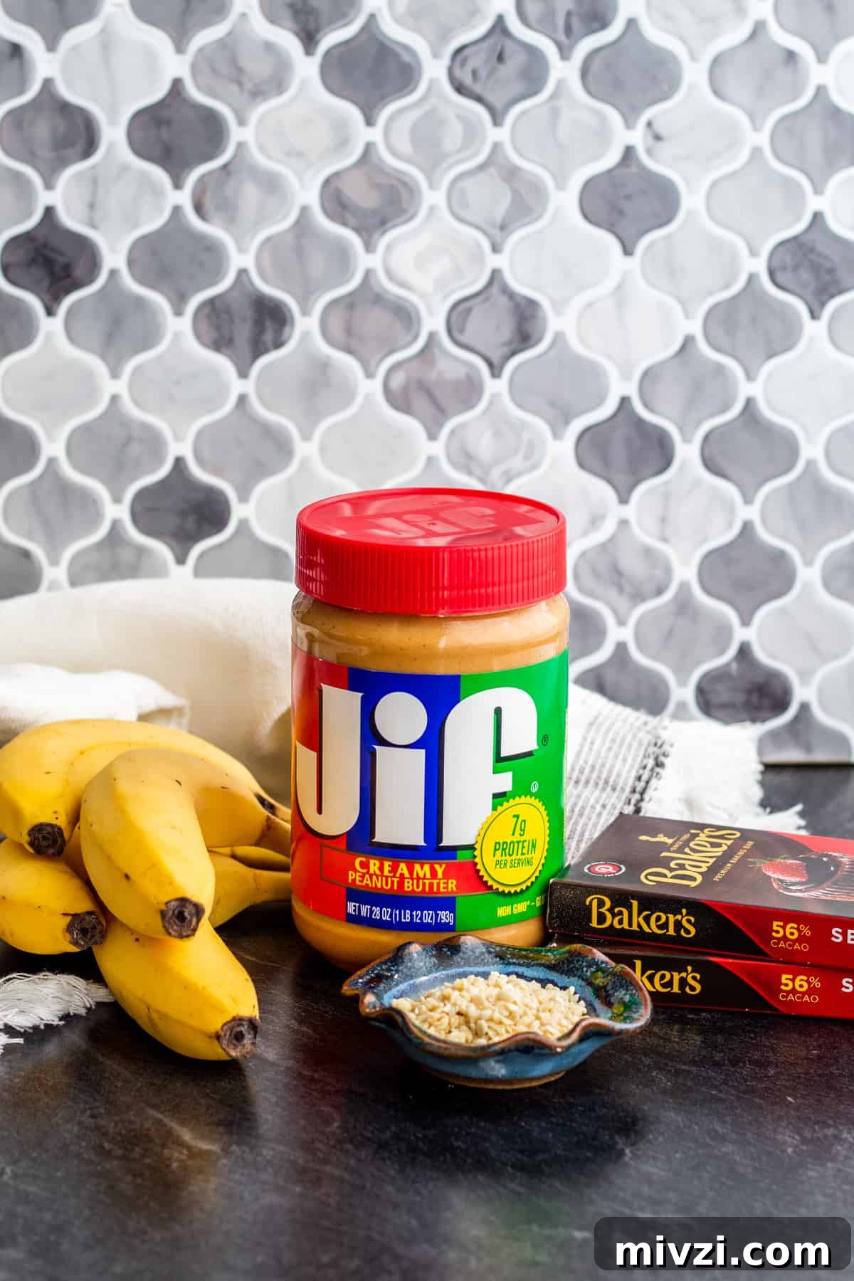 Ingredients for frozen banana bites on blue counter.