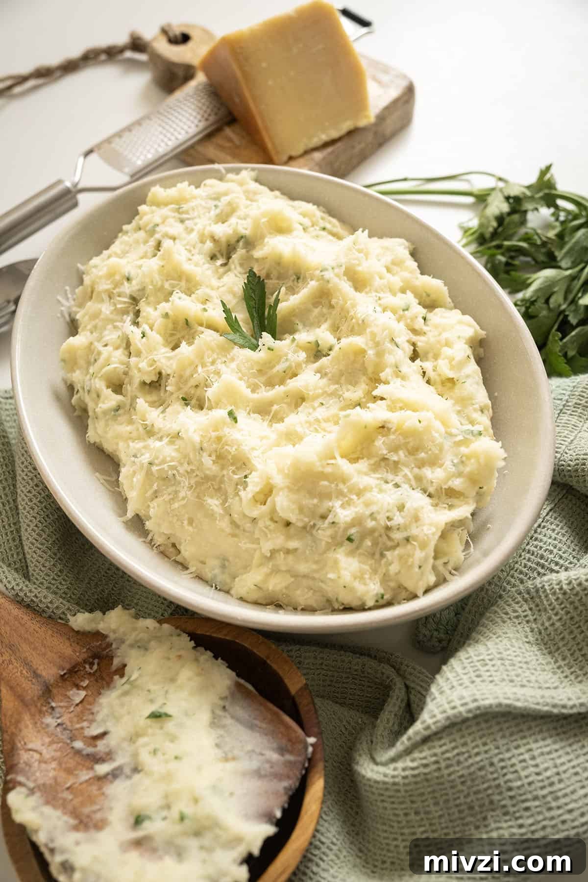 Garlic Parmesan Mashed Potatoes Recipe — Creamy Comfort Side Dish 2 Garlic parmesan mashed potatoes in a bowl.