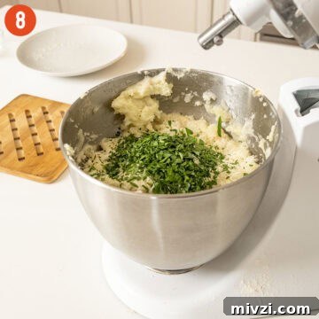 Garlic Parmesan Mashed Potatoes Recipe — Creamy Comfort Side Dish 11 Chopped parsley combined with mashed potatoes.