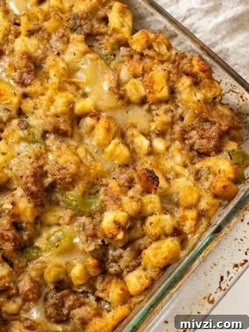 Italian sausage stuffing baked in a glass baking pan.