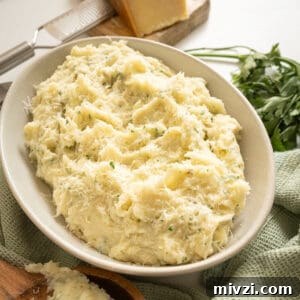 Garlic Parmesan Mashed Potatoes Recipe — Creamy Comfort Side Dish 17 Garlic parmesan mashed potatoes in a bowl.