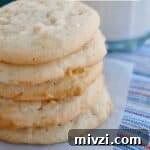 close up of lemon coconut sugar cookies stacked up