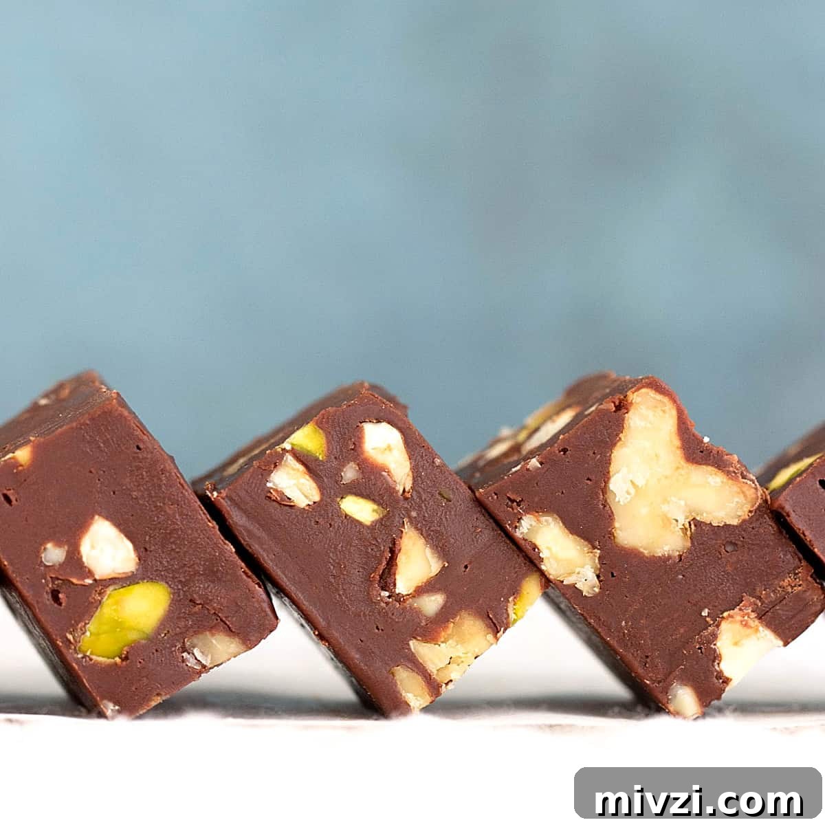 Quick Microwave Chocolate Fudge: Ready in Minutes 6 Row of chocolate fudge squares, blue background