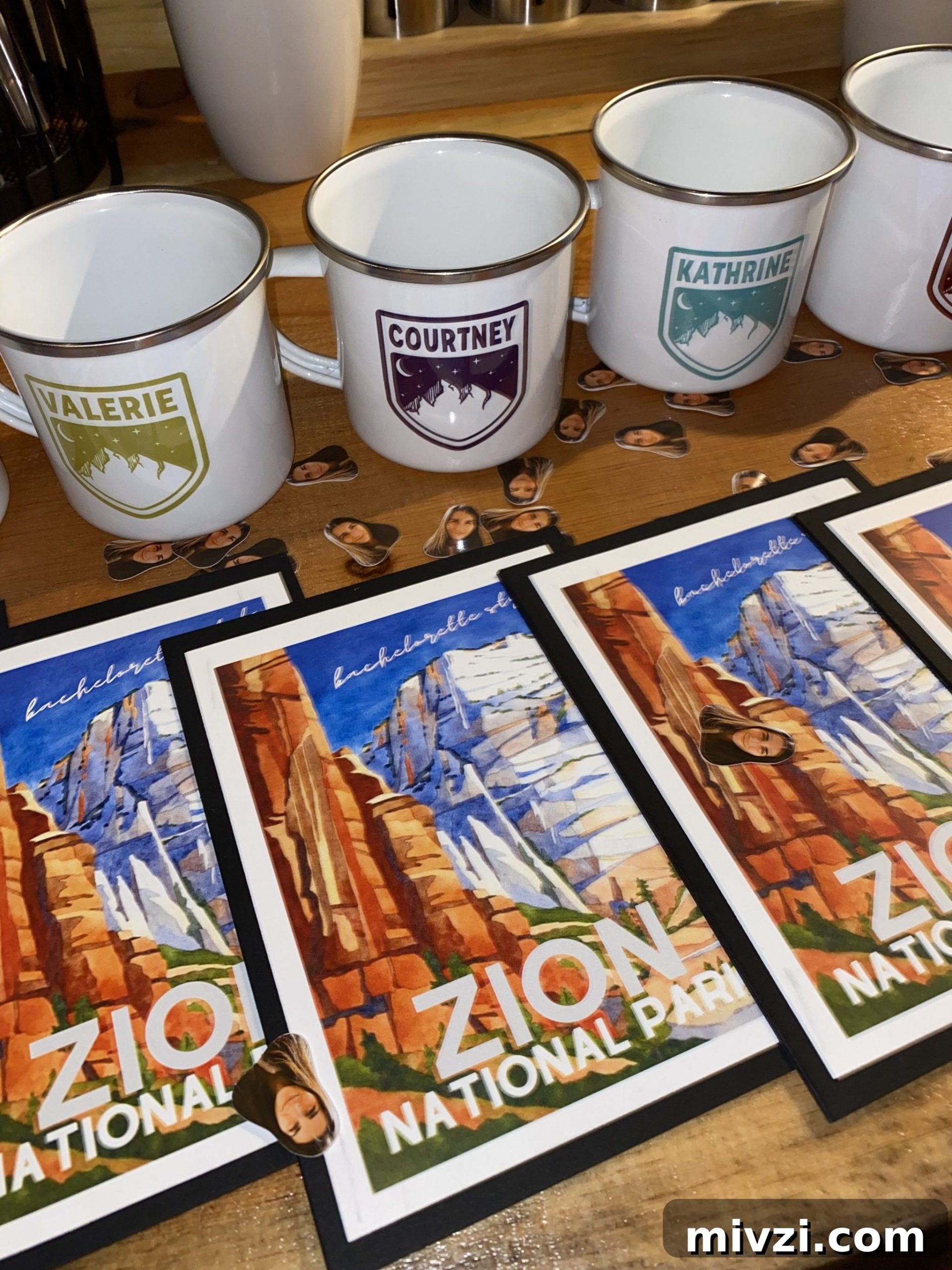 zion prints and campfire mugs displayed on a table