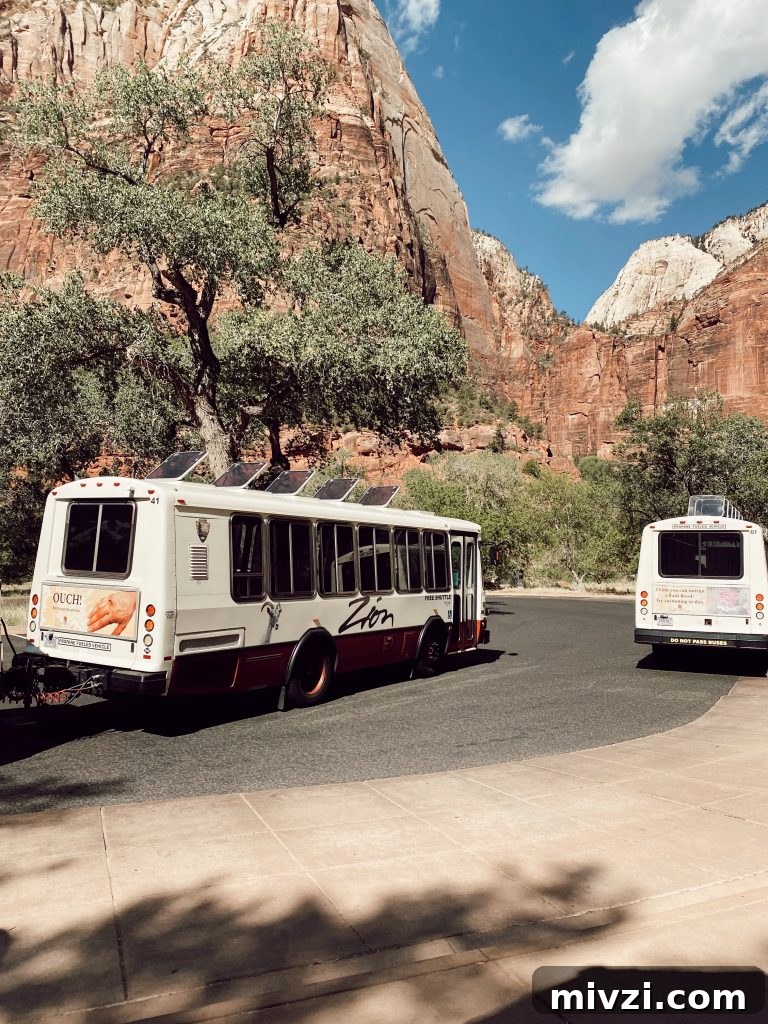 two national park buses in Zion National Park