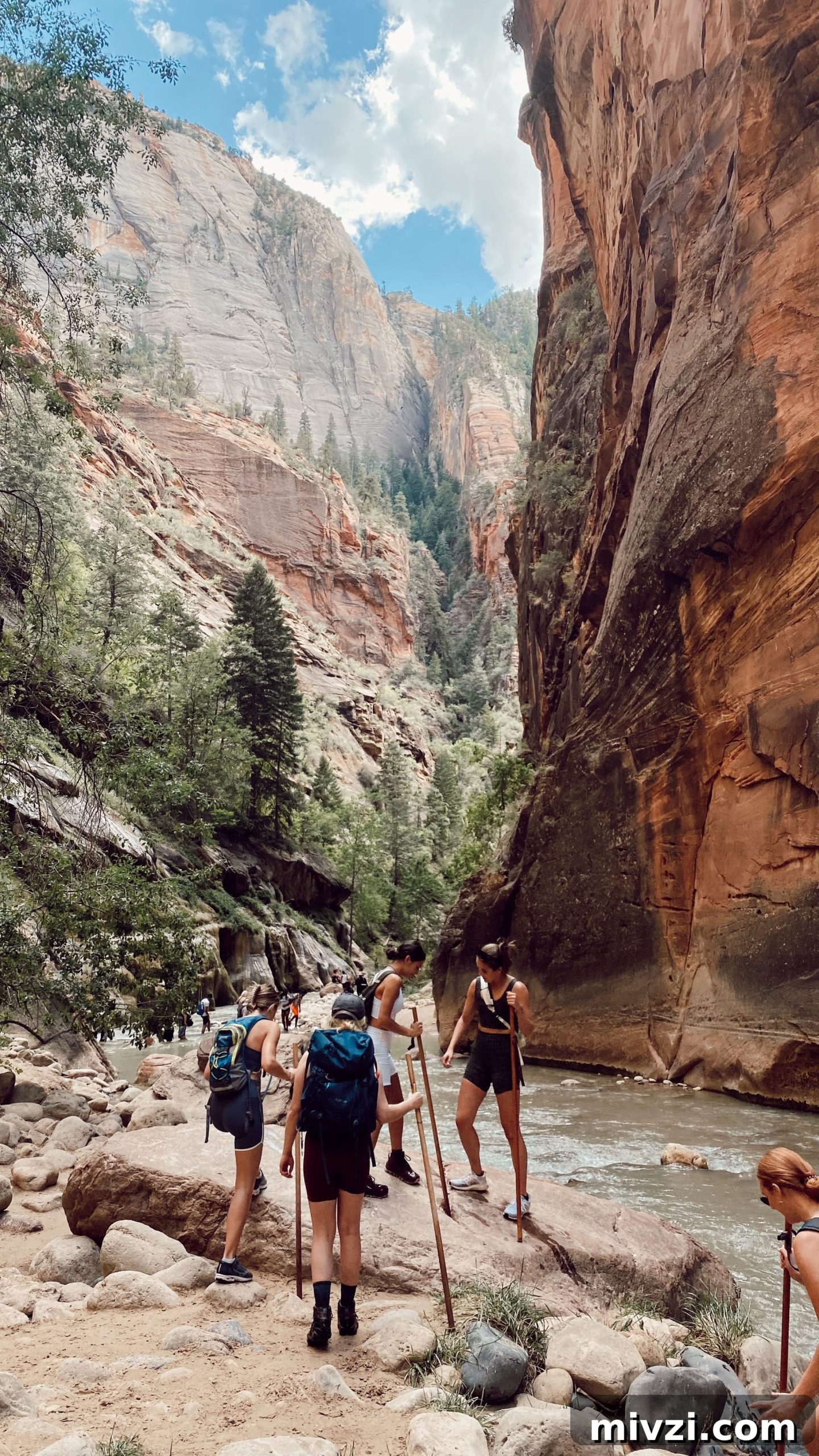 action shot of six girls hiking in The Narrows
