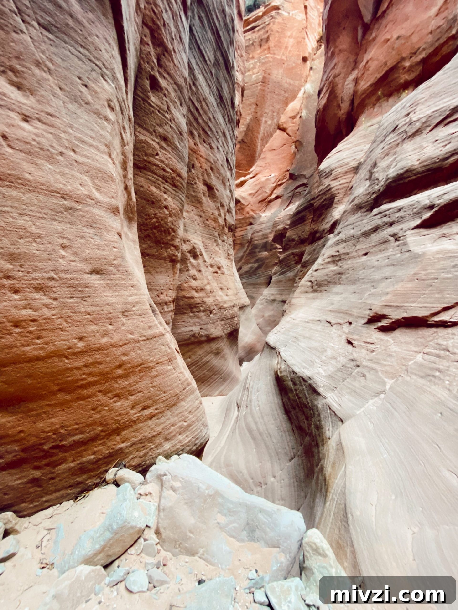 narrow pathway in between two large mountains