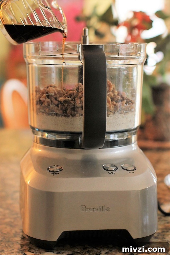 Maple Walnut Energy Bites: High-Protein Snack Recipe 3 maple walnut energy balls ingredients in food processor