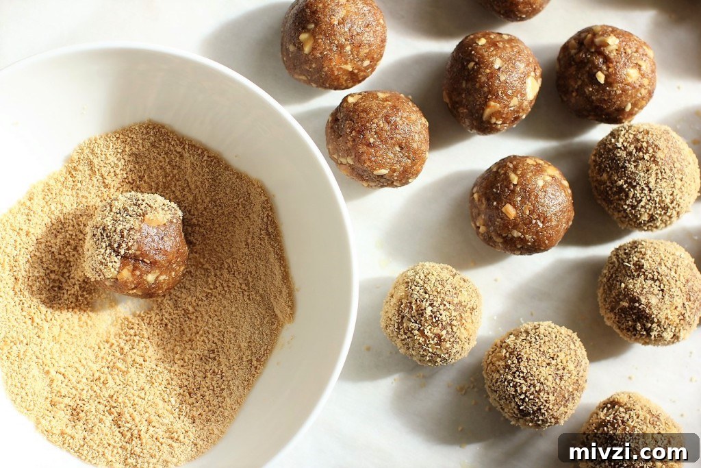 Maple Walnut Energy Bites: High-Protein Snack Recipe 7 rolling maple walnut energy balls in maple sugar