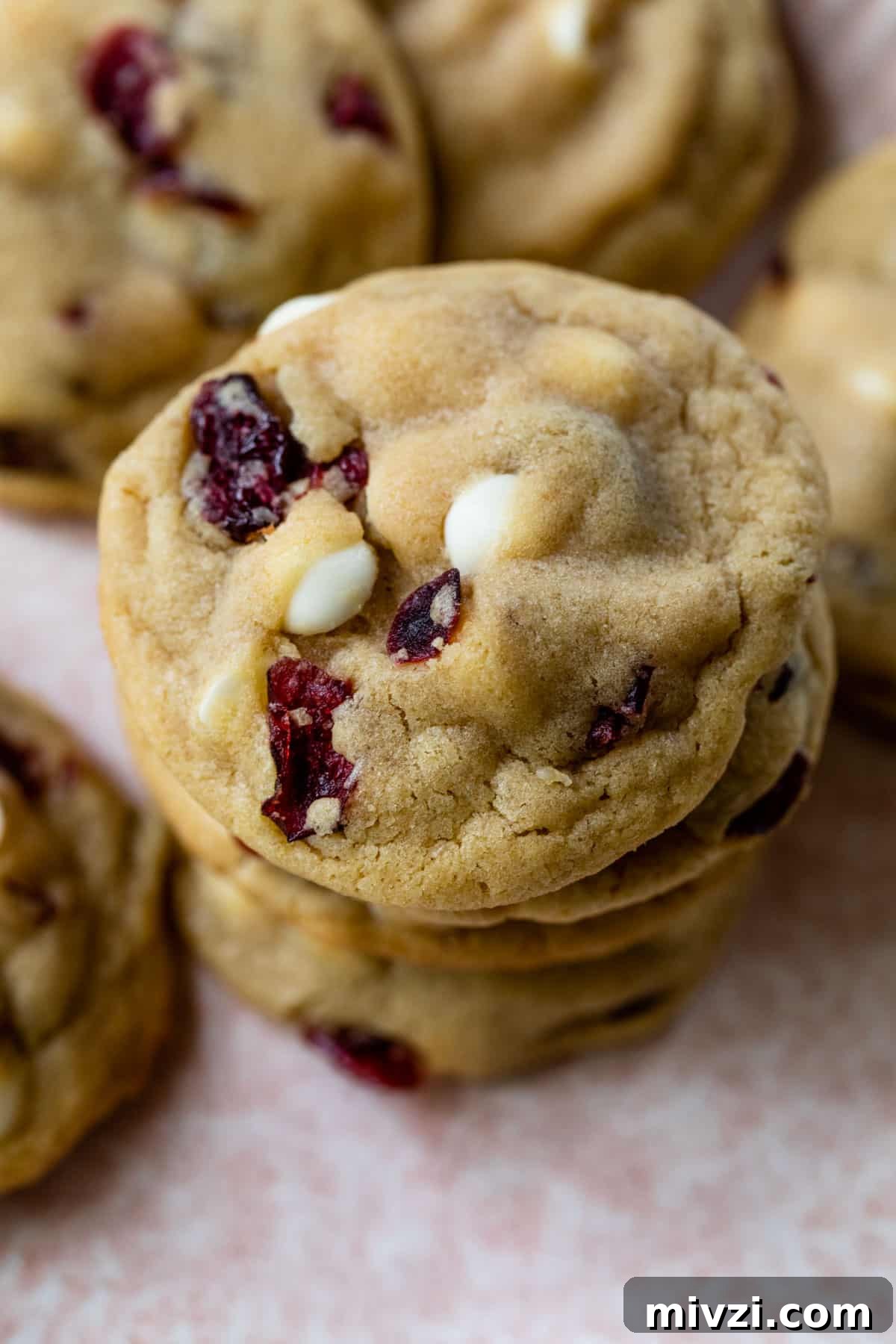 cranberry white chocolate cookies stacked on top of each other