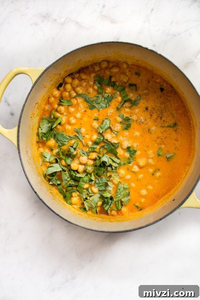 Creamy Chickpea Coconut Curry: Simple Vegan Dinner Recipe 3 a yellow pot with easy chickpea coconut curry