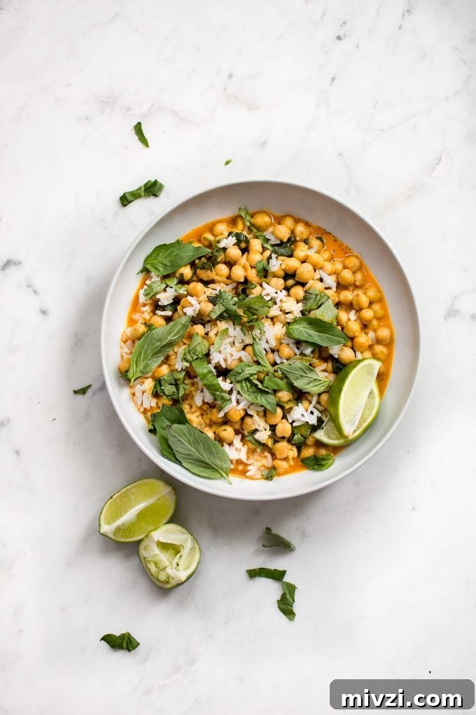 Creamy Chickpea Coconut Curry: Simple Vegan Dinner Recipe 4 bowl of chickpea coconut curry on a marble surface