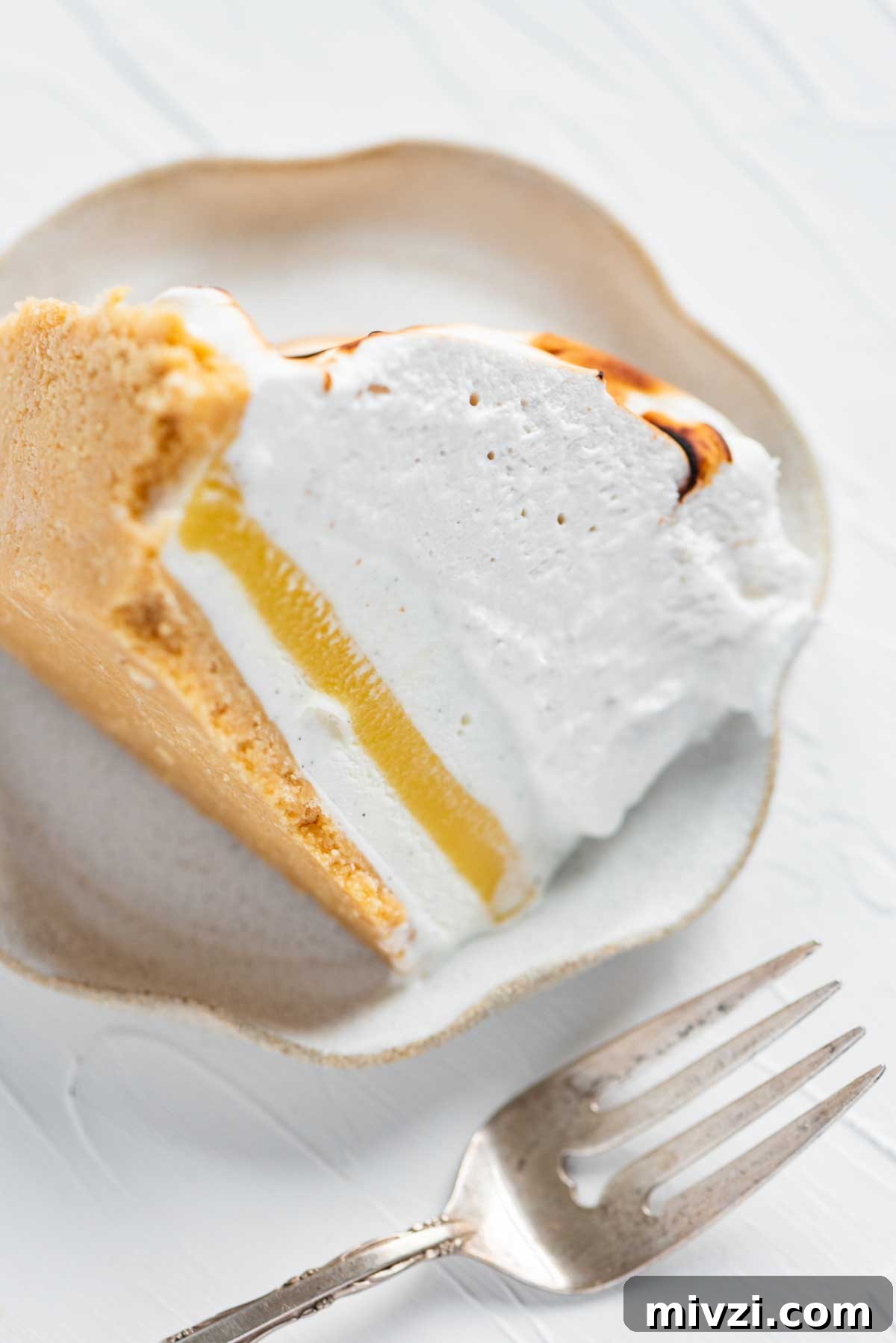 Slice of lemon meringue ice cream pie on its side from BeyondtheButter.com | © Beyond the Butter®