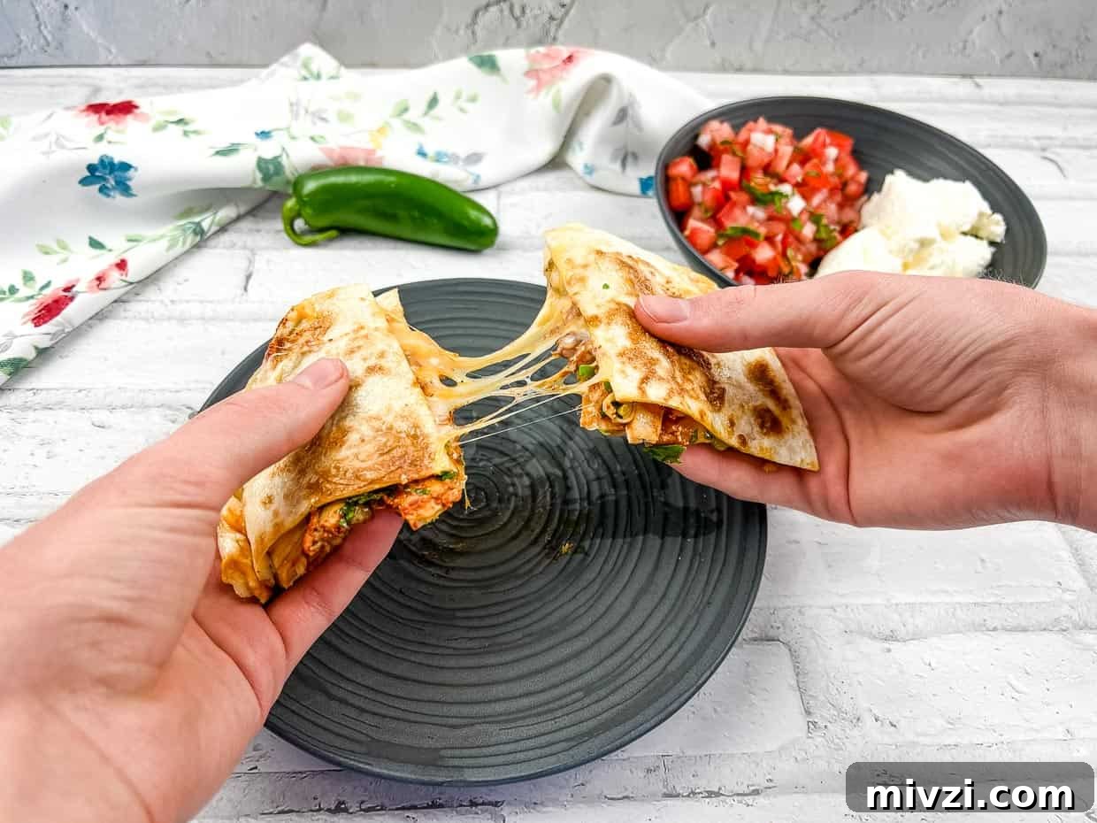 37 Winter Olympics Dishes to Warm Cold Nights and Long Broadcasts 10 Al pastor chicken quesadillas pulled apart.