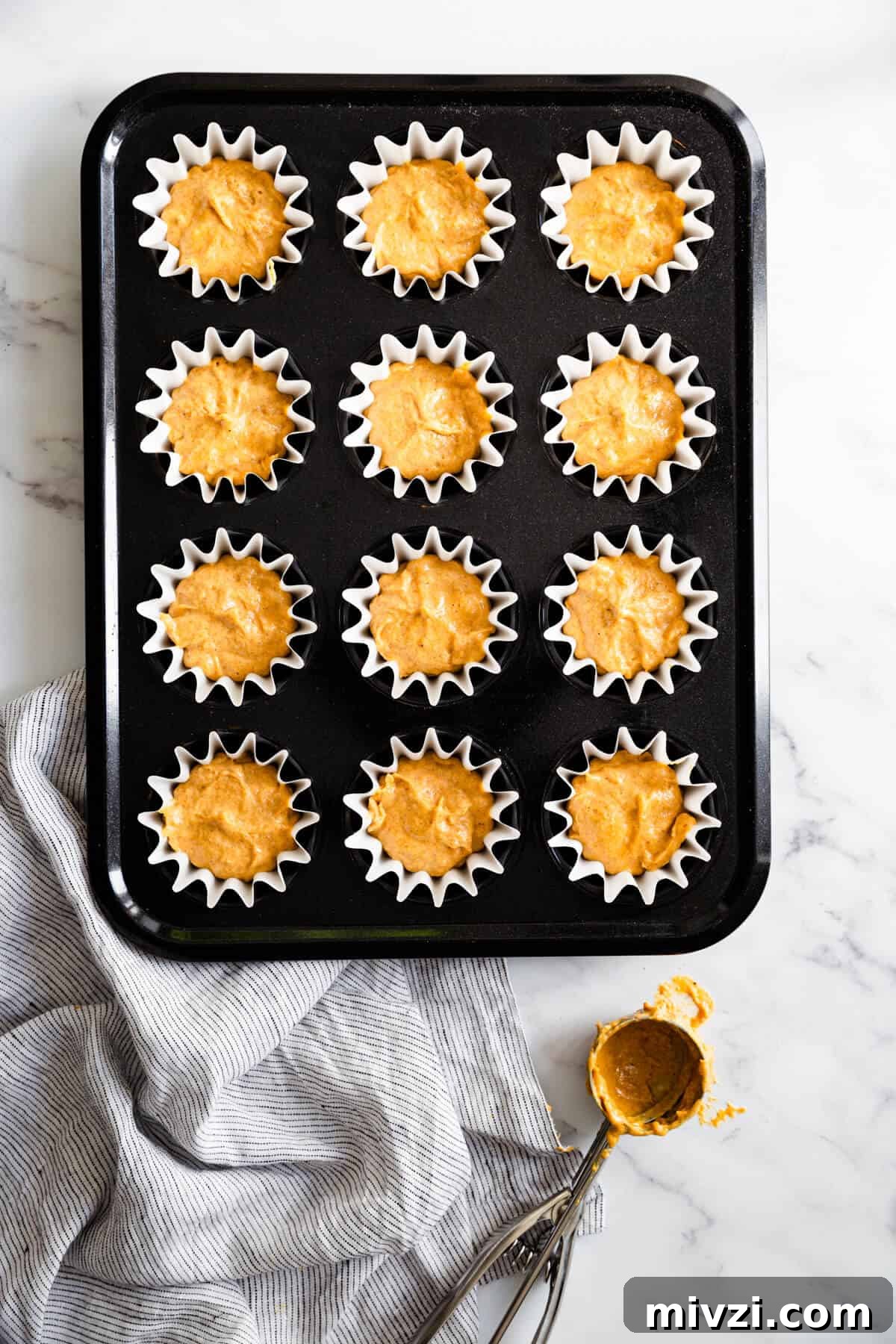 top view of baking tin filled with cupcake batter
