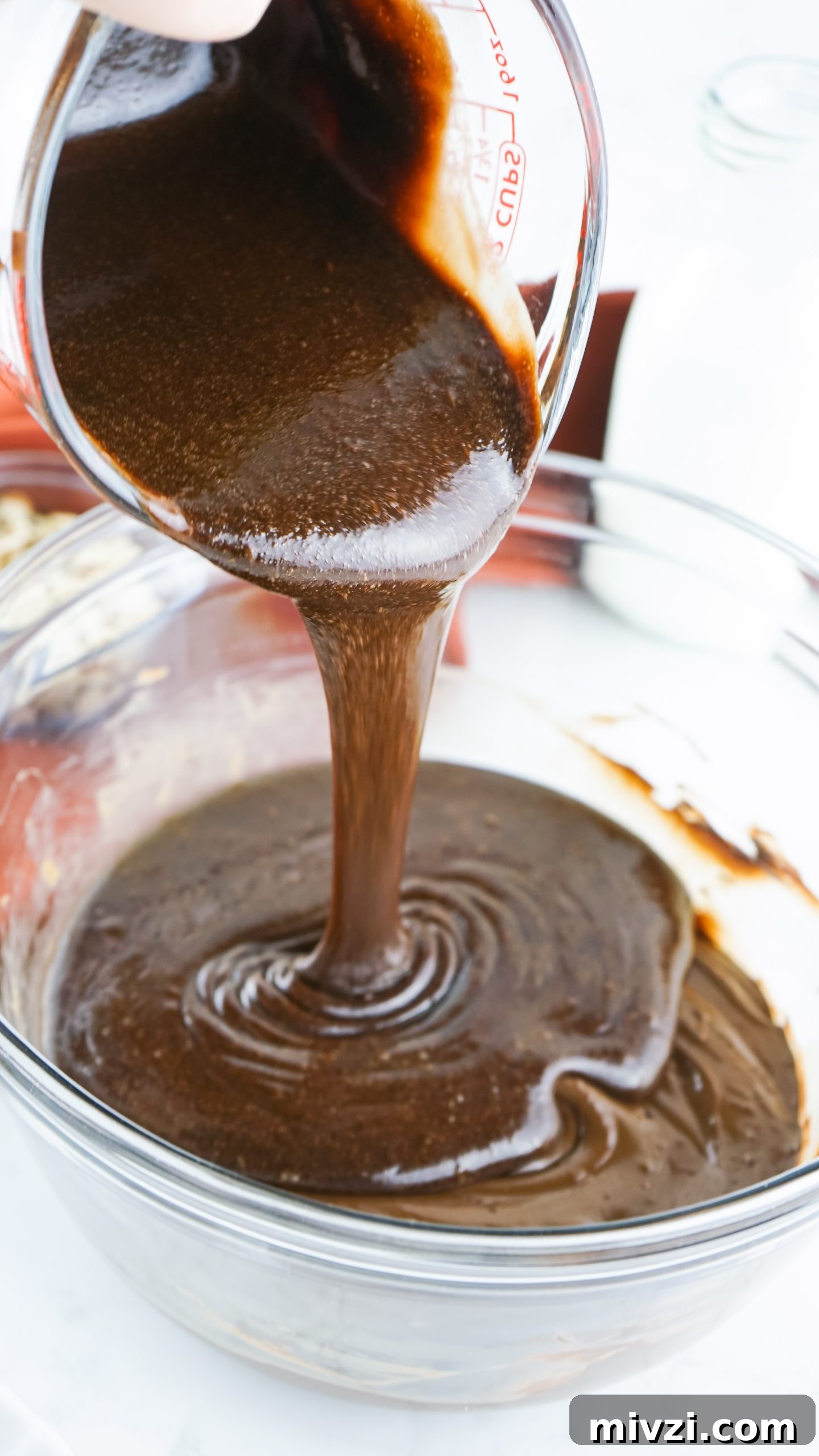 Microwave Chocolate Almond Fudge Recipe: Quick & Rich Treat 5 Melted chocolate mixture.
