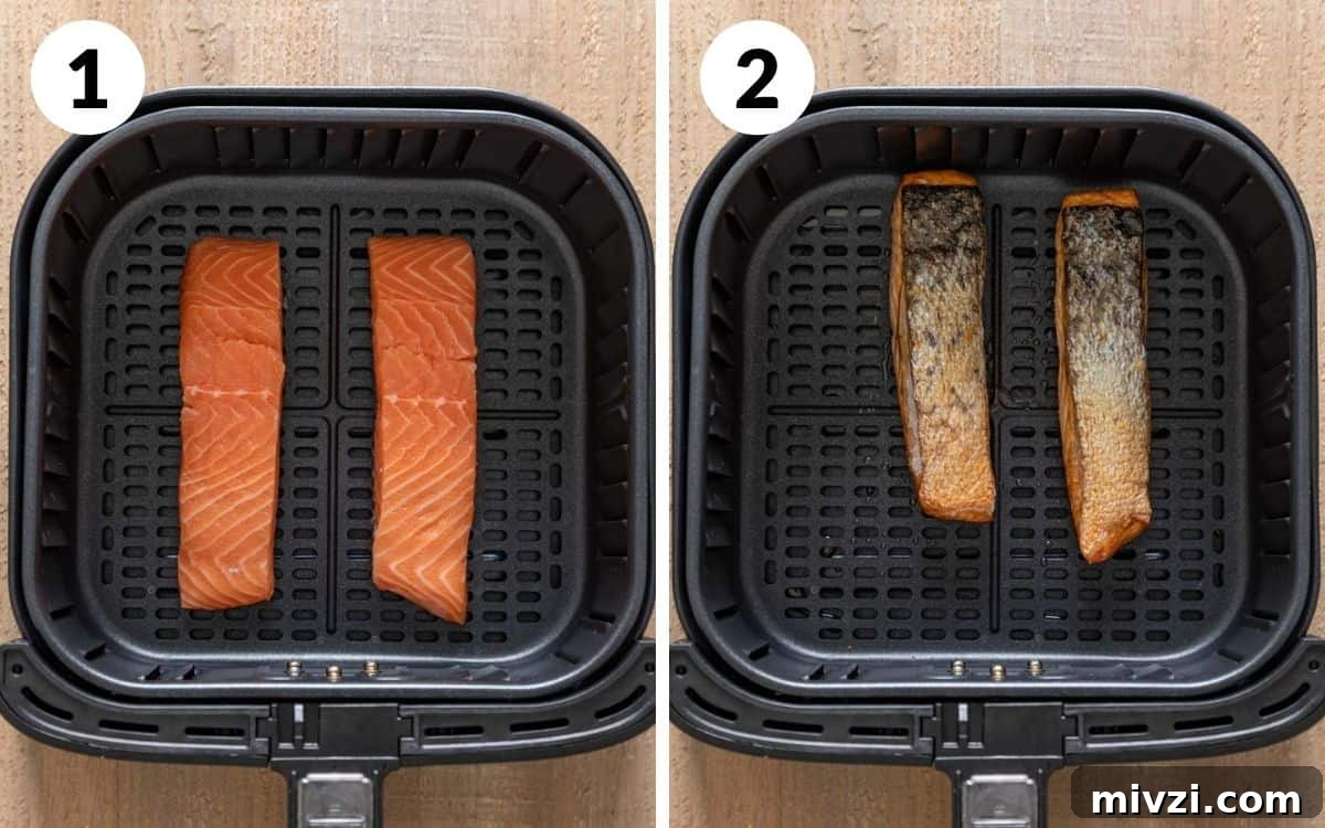 salmon fillets in the air fryer basket and cooked salmon skin side up