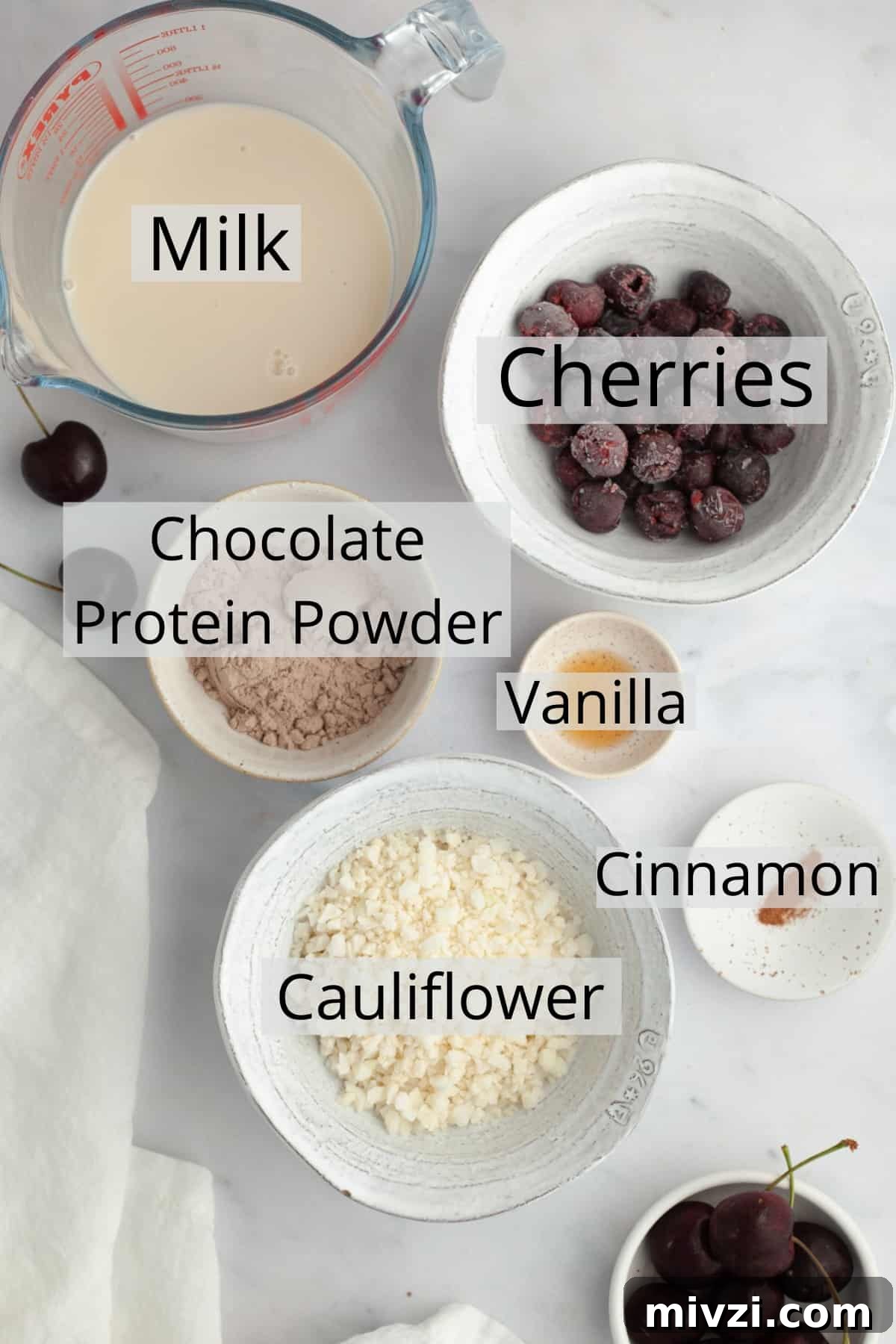 5-Minute Chocolate Cherry Smoothie Recipe 3 All the ingredients needed to make a chocolate cherry smoothie, weighed out into a small bowl.