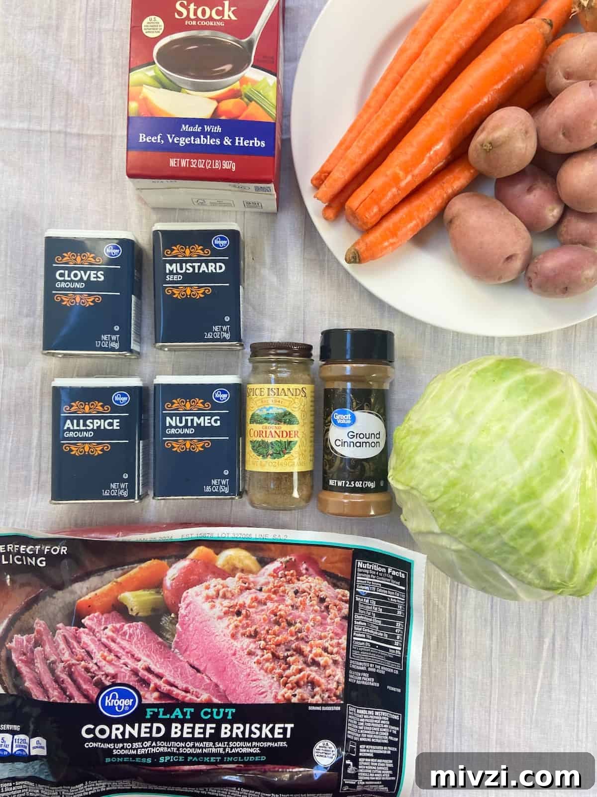 Slow Cooker Corned Beef and Cabbage Recipe for Tender, Juicy Results 3 Corned Beef ingredients on white tablecloth.