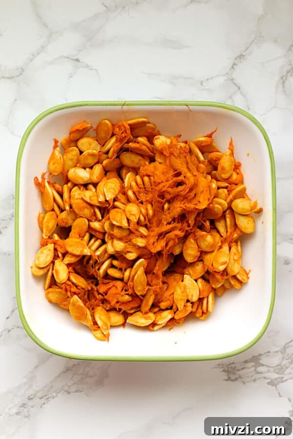 Roasted Pumpkin Seeds Recipe: Crispy Oven-Baked Snack in 20 Minutes 3 Squash seeds in a bowl