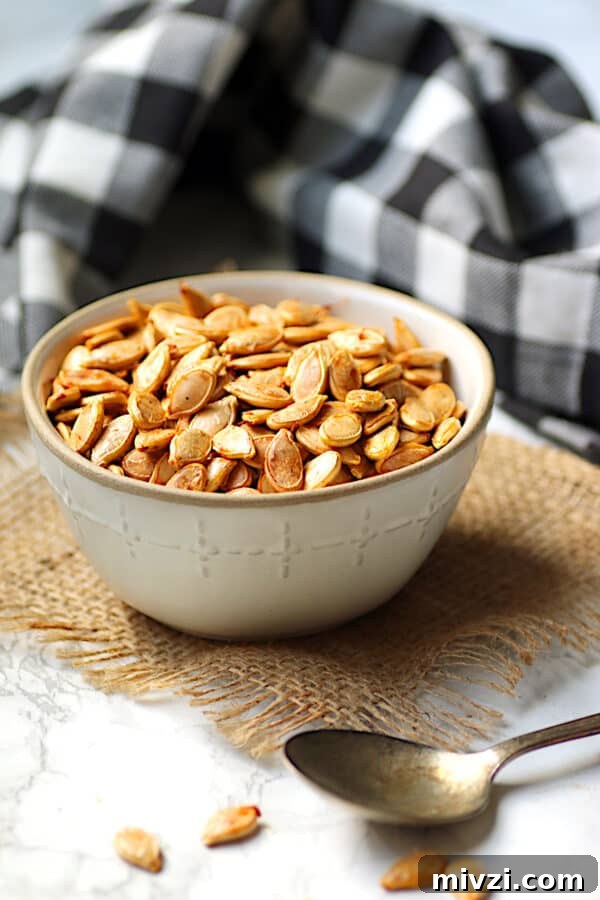 Roasted Pumpkin Seeds Recipe: Crispy Oven-Baked Snack in 20 Minutes 5 Homemade roasted pumpkin seeds in a bowl.