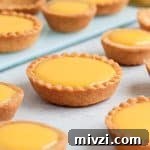 Close up on a tartlet on a grey surface.