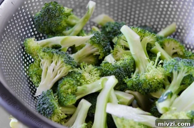 broccoli florets in metal colander