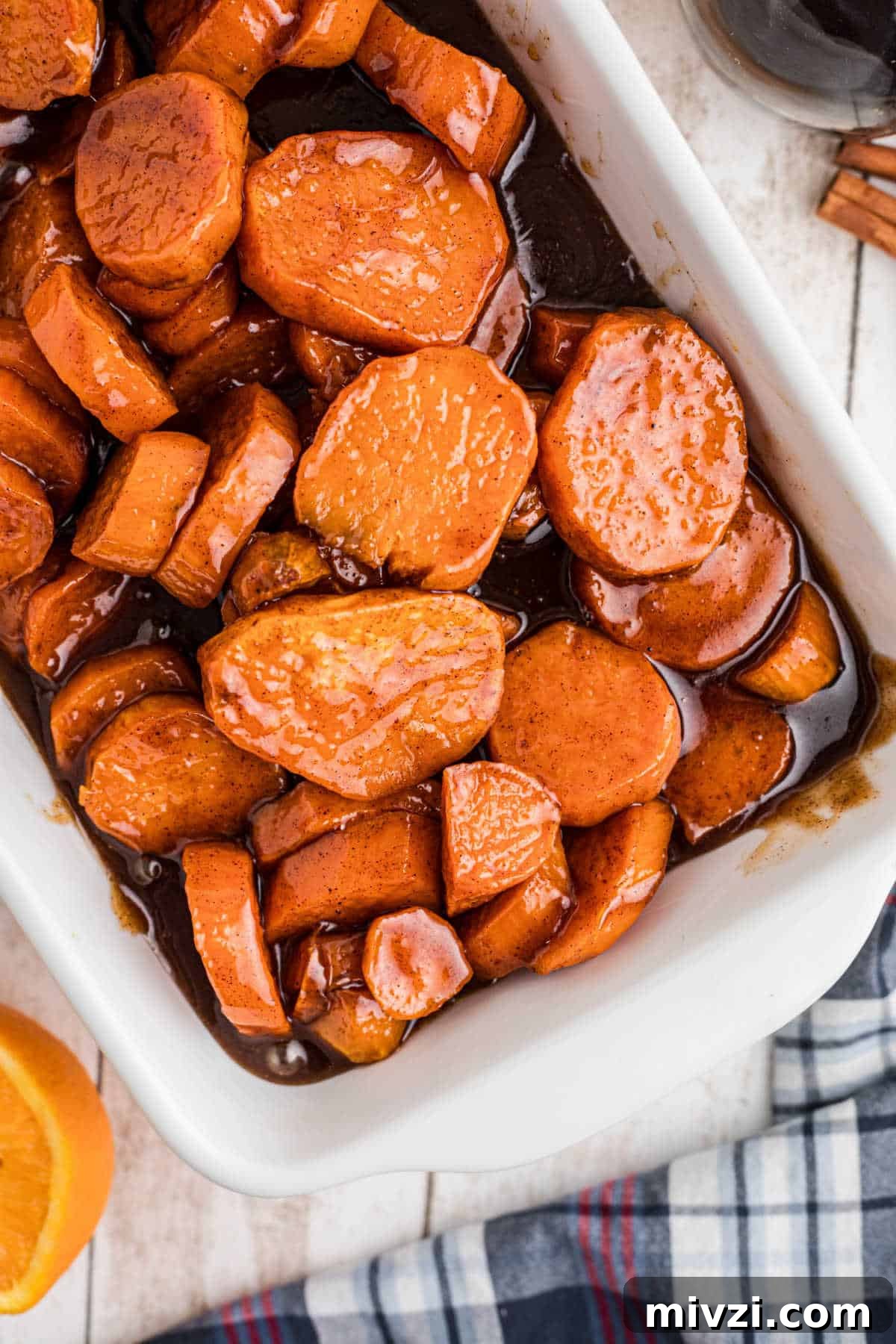 Southern-Style Candied Yams with Brown Sugar Glaze 10 An overhead shot of a dish filled with candied yams.