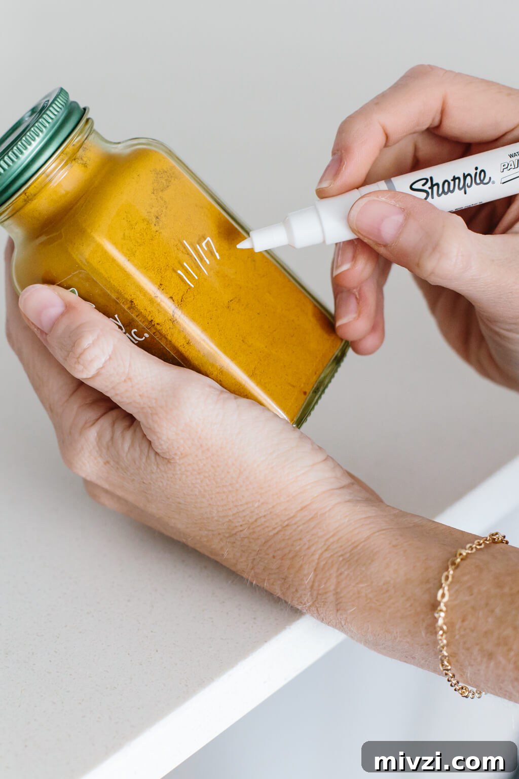 My spice drawer is pivotal to cooking healthy recipes. So today I'm sharing how I organize my spice drawer and giving you a few tips for dried spices. #SpiceOrganization #SpiceDrawer #SpiceRack #KitchenOrganization #KitchenIdeas