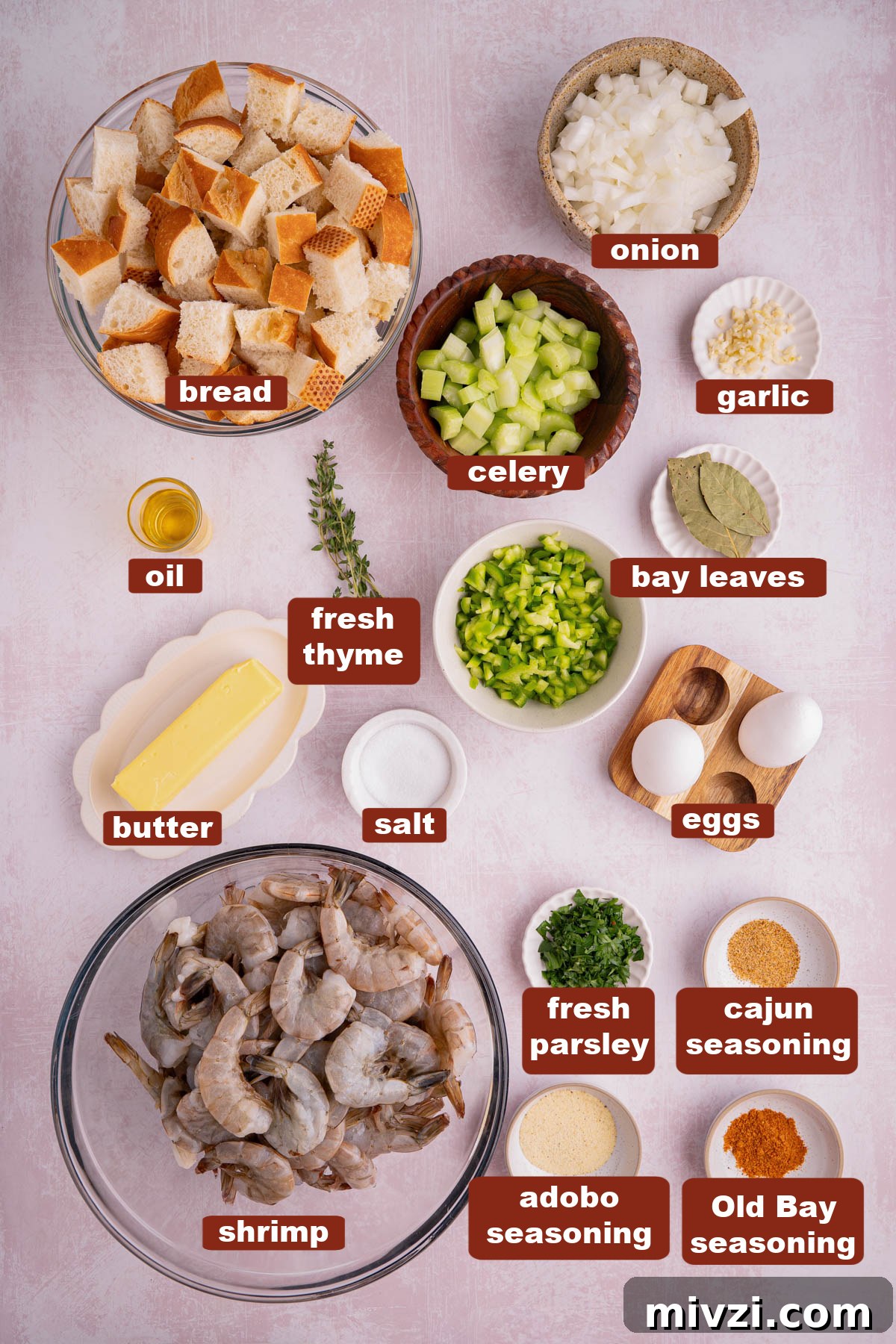 Savory Seafood Stuffing Recipe for Holidays and Dinner 2 All of the ingredients for shrimp stuffing in bowls on a countertop.