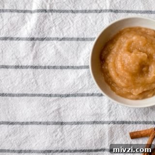 Homemade Applesauce Recipe: Smooth, Natural, and Easy to Make 4 bowl of homemade applesauce with cinnamon sticks on a striped tablecloth