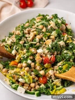 large white bowl with kale, chickpea and chicken salad