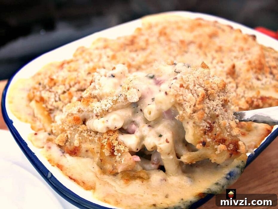 Bacon and Crab Mac n Cheese is a delicious side or main dish, with a rich creamy cheese sauce and amazing flavors from smokey bacon and crabmeat. Really tasty!