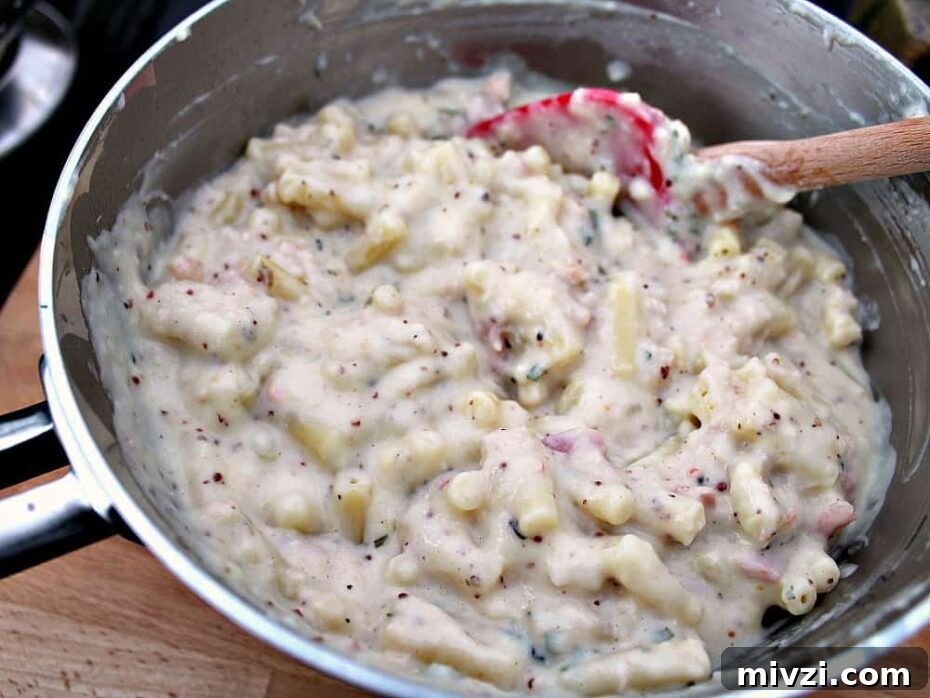 Bacon and Crab Mac n Cheese, add the macaroni and other ingredients to the pan