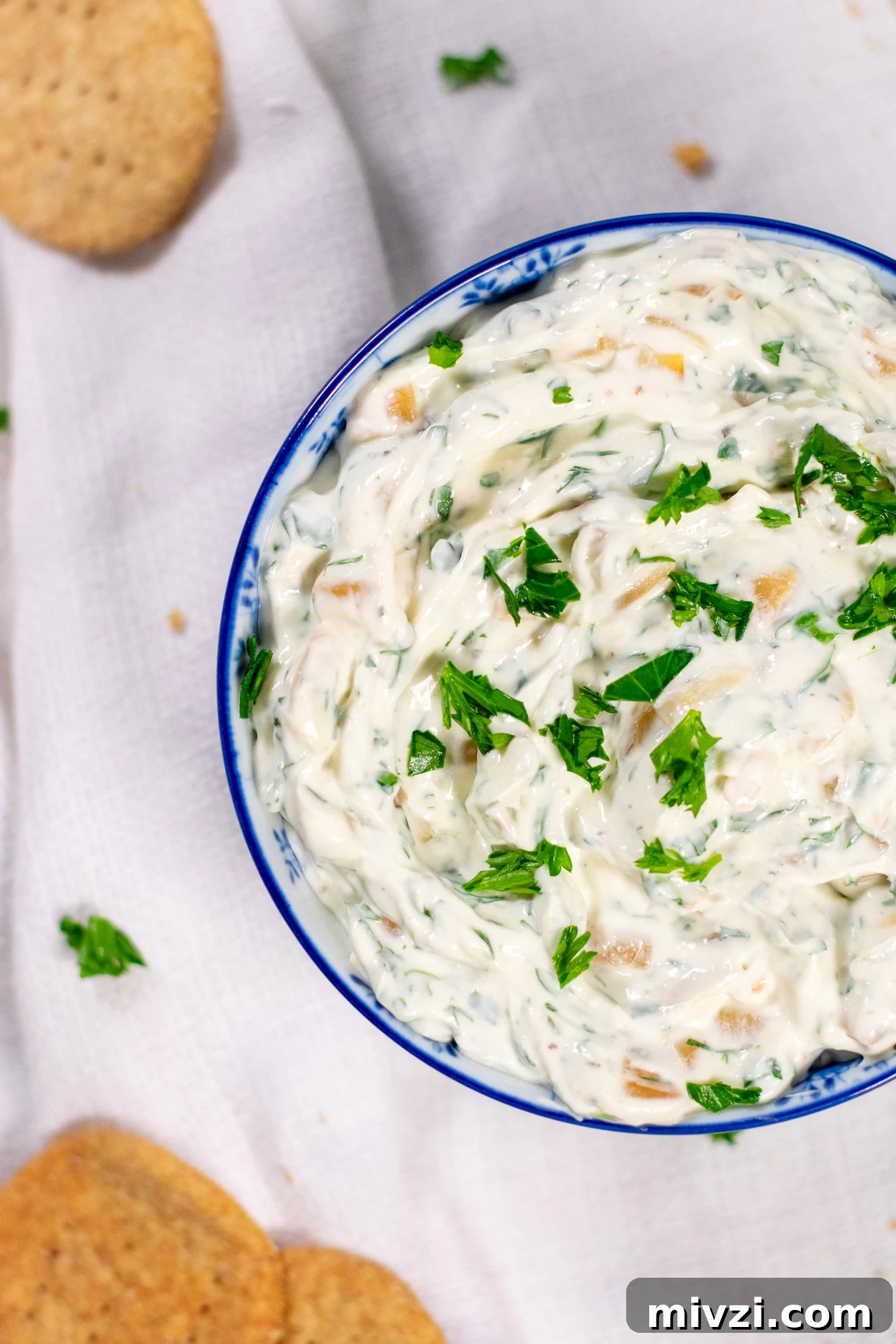 Dip with onion and dill in a bowl.