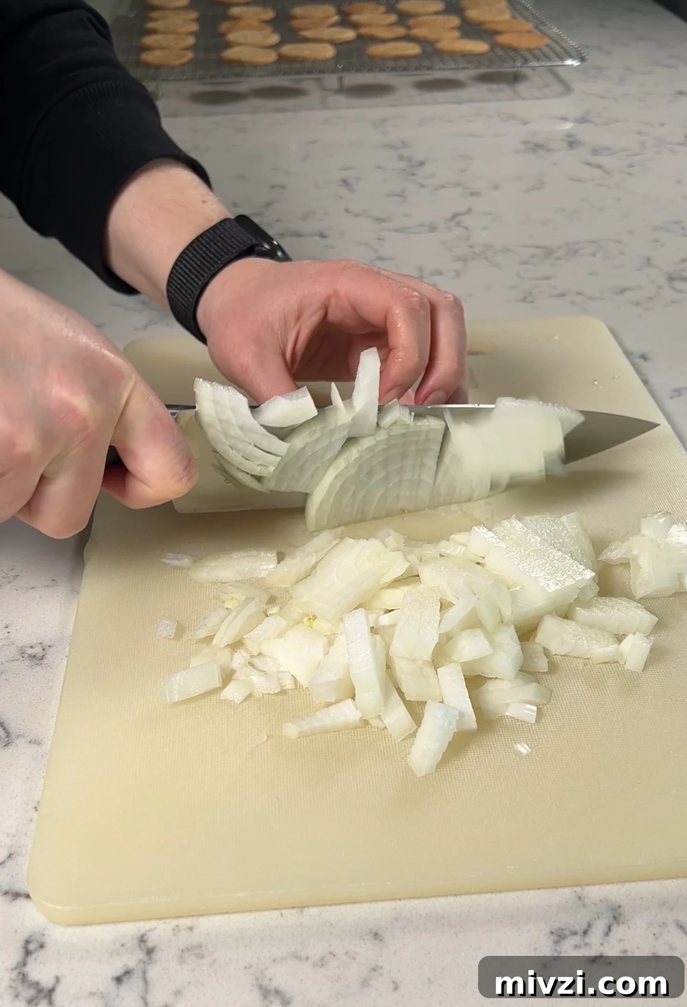 Chopping up an onion.