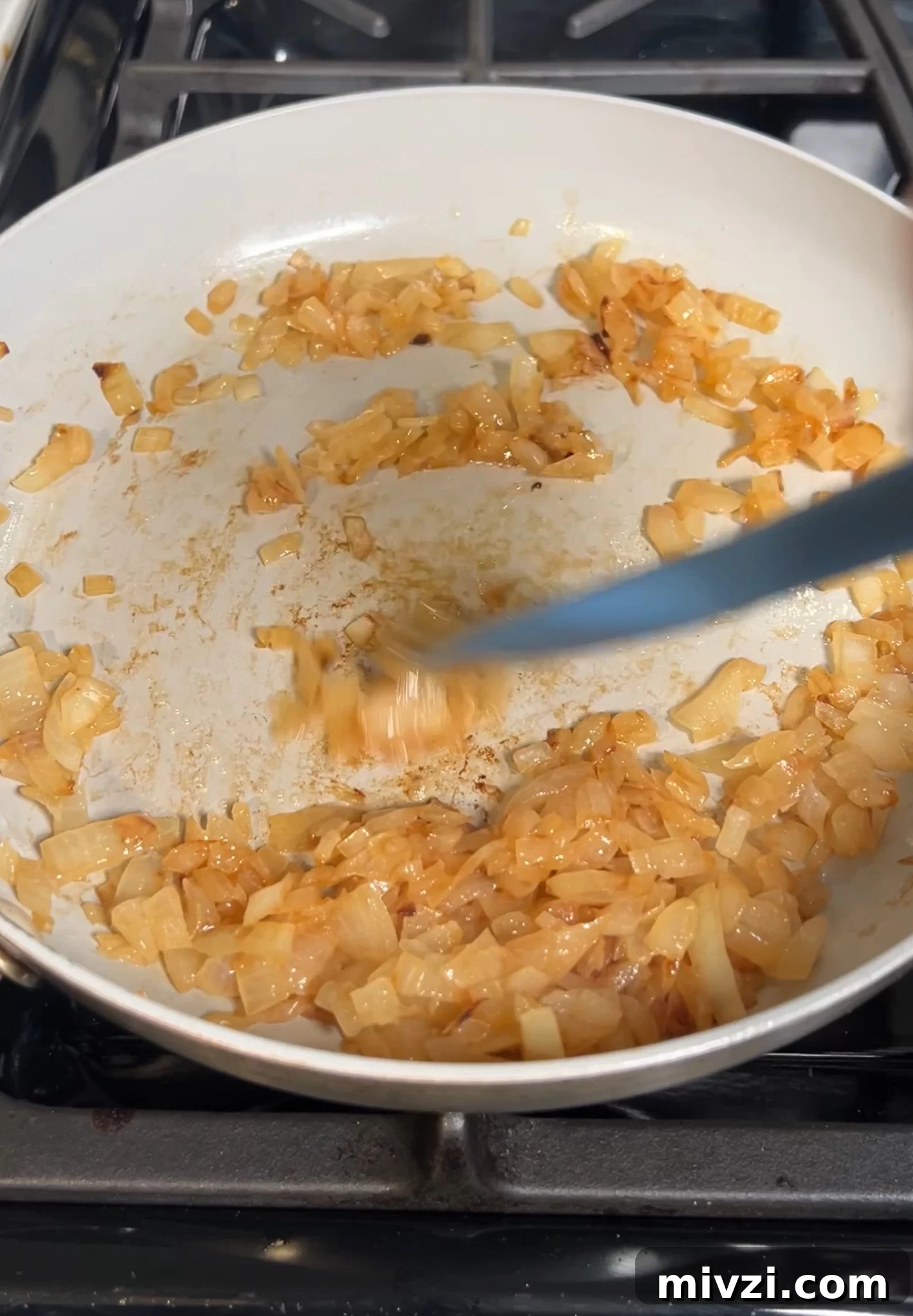 Cooking onions in a pan.
