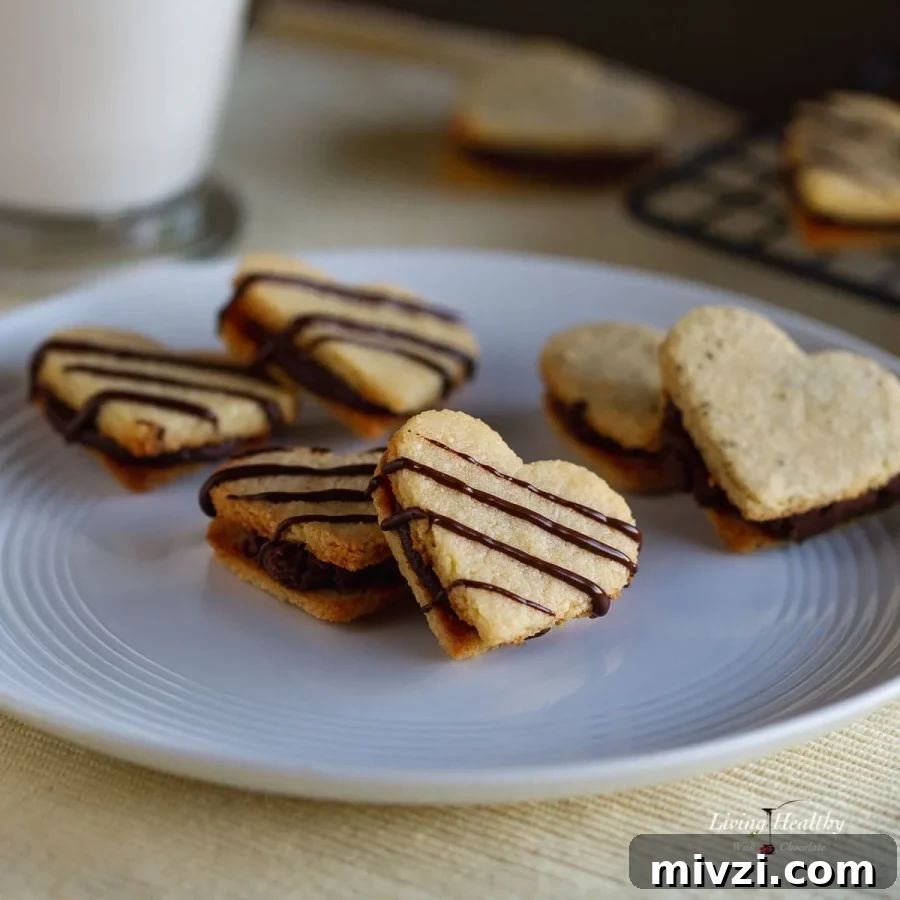 chocolate filled vanilla cookies in heart shapes