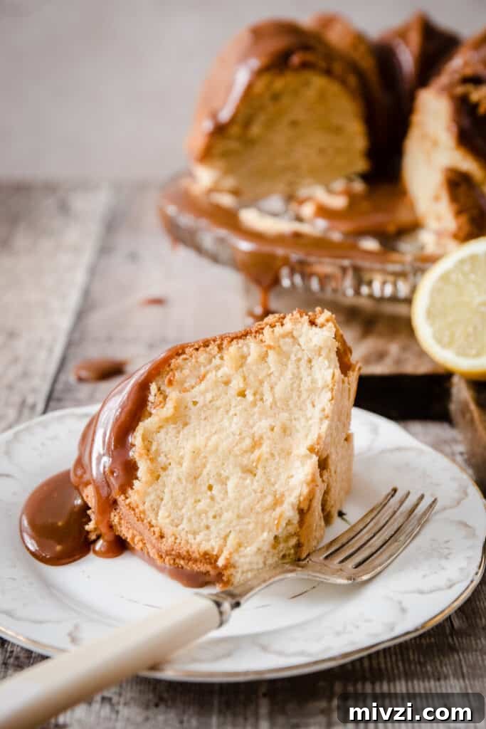 Gluten-Free Lemon Bundt Cake with Tangy Lemon Caramel 3 A slice of lemon caramel cake on a plate