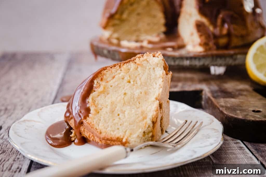 Gluten-Free Lemon Bundt Cake with Tangy Lemon Caramel 10 A piece of cake on a plate with a fork