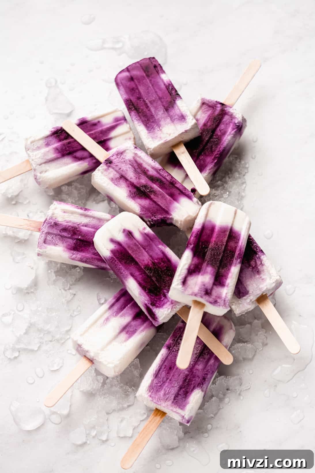 Blueberry Greek Yogurt Popsicles Recipe: Creamy Frozen Treats 5 a stack of blueberry greek yogurt popsicles