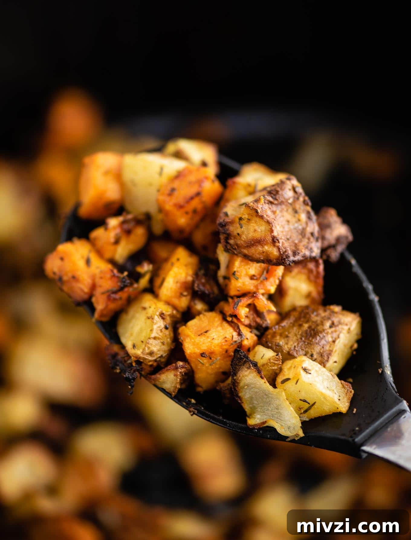 Crispy Air Fryer Breakfast Potatoes Recipe 4 air fryer breakfast hash on a black spoon