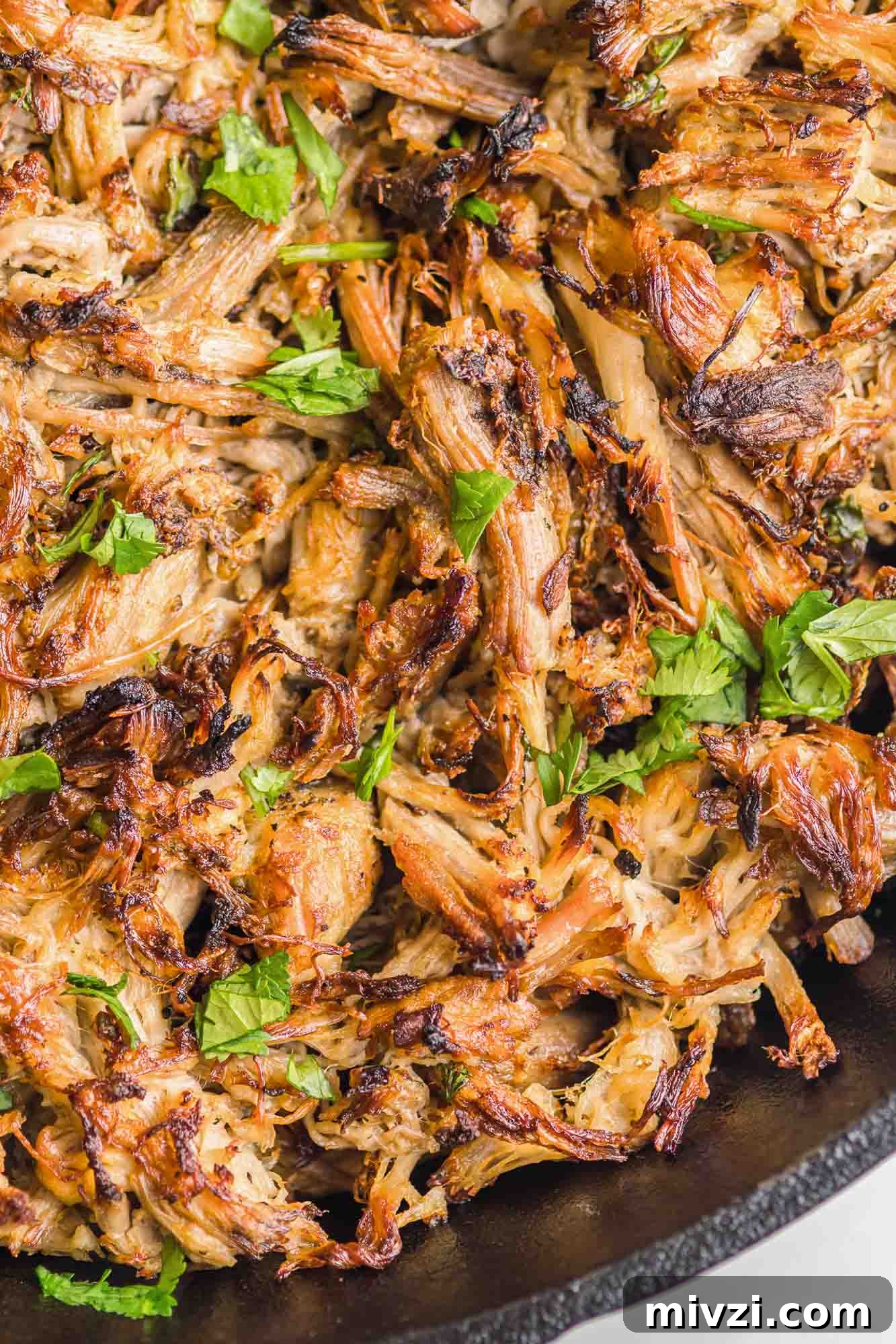 Tender Instant Pot Carnitas Recipe for Quick Mexican Pulled Pork 2 Crispy Instant Pot Carnitas decorated with chopped fresh parsley