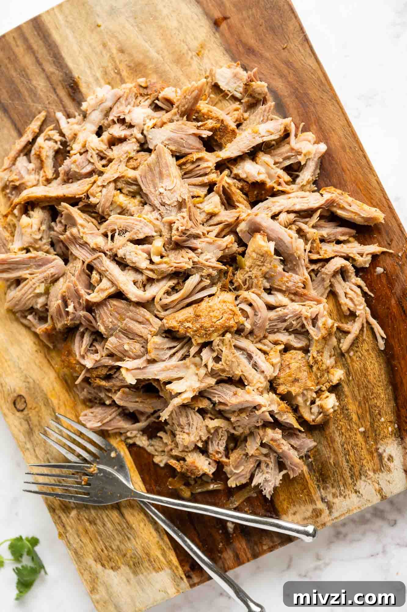 Tender Instant Pot Carnitas Recipe for Quick Mexican Pulled Pork 5 Shredded carnitas on a cutting board
