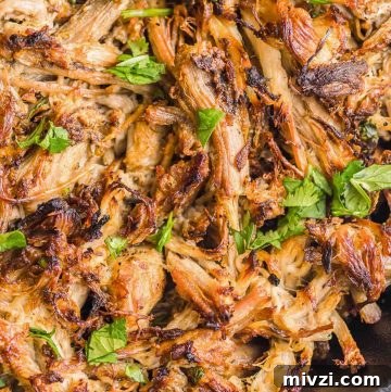 Tender Instant Pot Carnitas Recipe for Quick Mexican Pulled Pork 7 Instant Pot Carnitas crispy in a cast iron dish