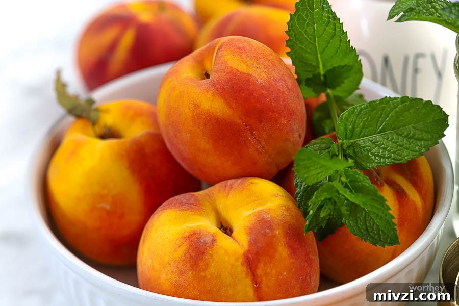 Refreshing Peach Mint Sorbet Recipe – Simple Summer Dessert 8 fresh juicy peaches from the Peach Truck in white bowl