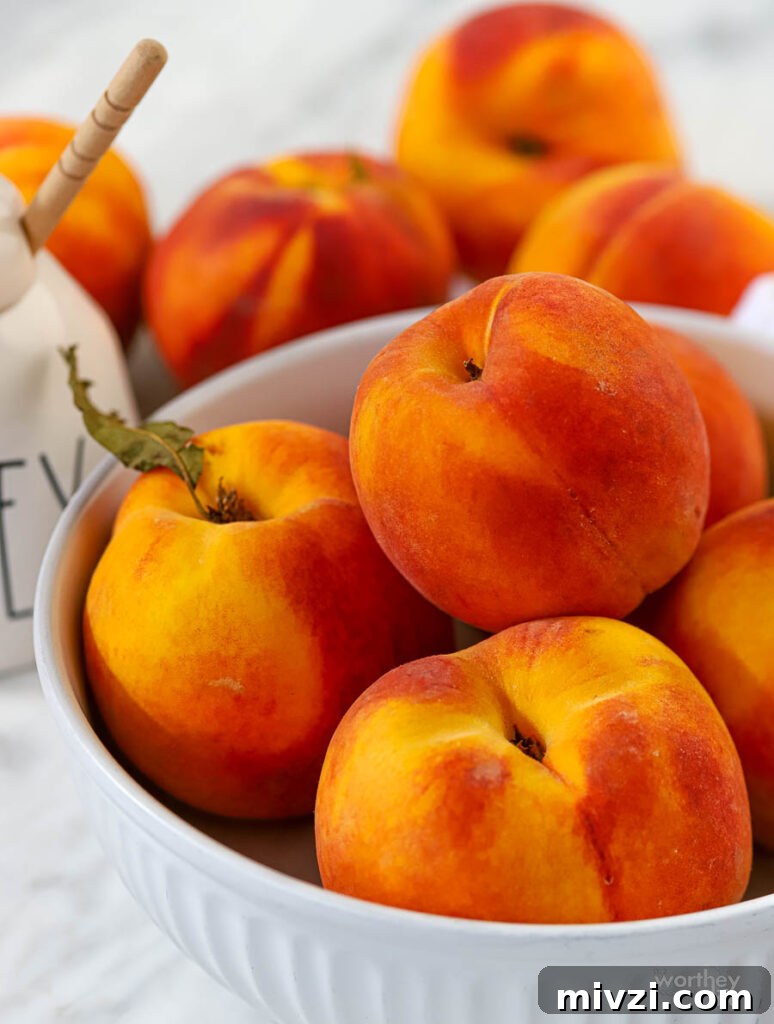Refreshing Peach Mint Sorbet Recipe – Simple Summer Dessert 5 a bowl of fresh ripe peaches